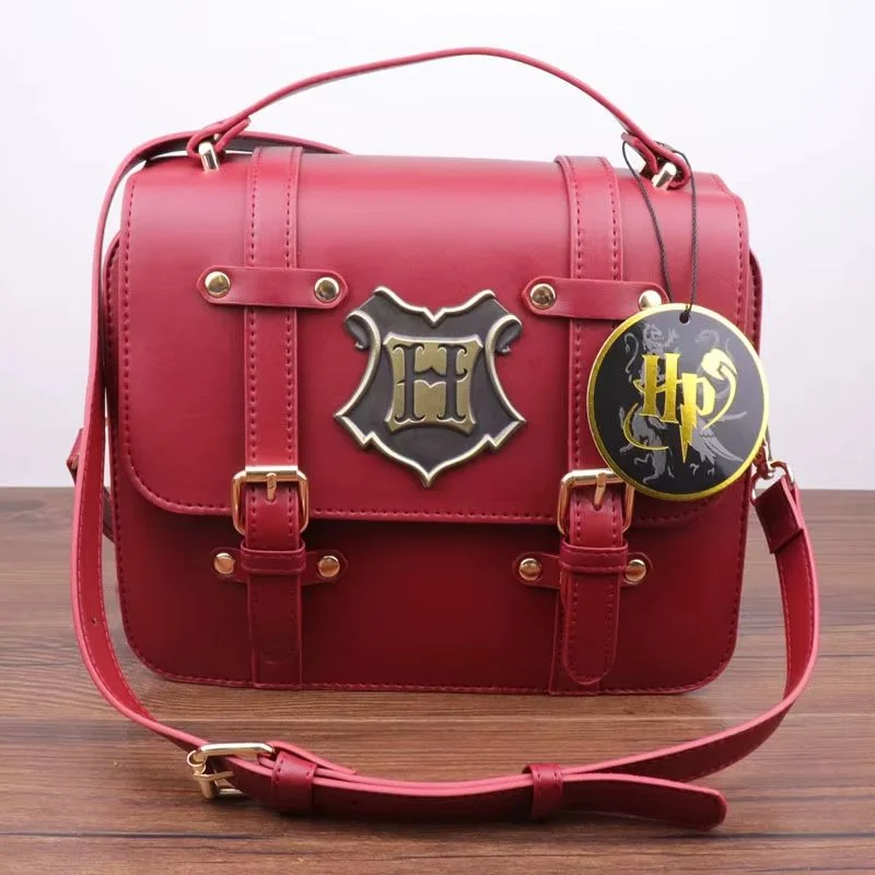 Bolso cartero Hogwarts Harry Potter rojo vinotinto con escudo metálico
