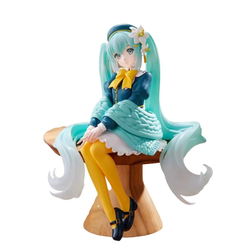 Figura Hatsune Miku sentada con cabello turquesa y lazo dorado