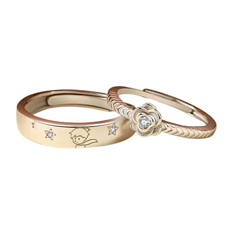 Set de dos anillos dorados El Principito con rosa y estrellas