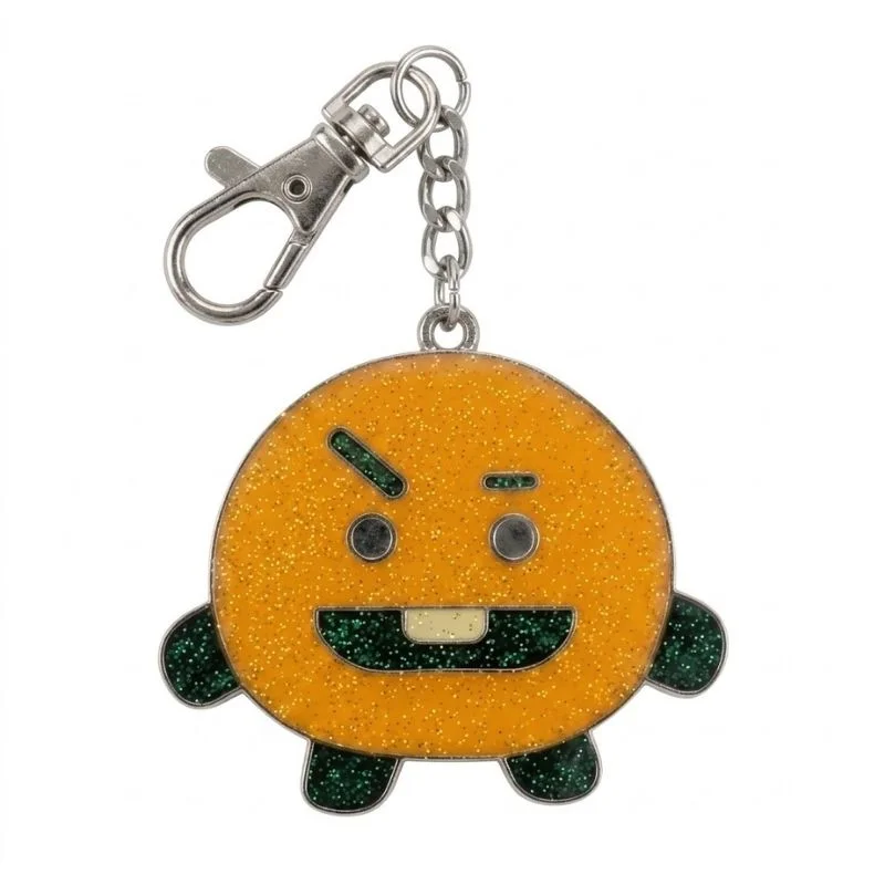 Llavero Shooky BTS metal con brillo dorado y detalles verdes